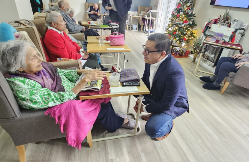 Abbas speaking with carehome resident